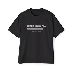 May include: A black short-sleeved t-shirt featuring white text that reads CONTEXT WINDOW FULL above a progress bar at 100% and the smaller text please start a new chat. The design is centred on the chest of the garment.