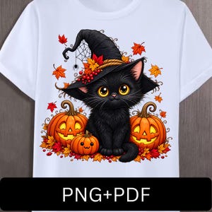 May include: A white t-shirt featuring a graphic of a black kitten wearing a pointed witch hat. The kitten is surrounded by orange jack-o'-lanterns, red berries, and autumn leaves. A small spider hangs from the hat. The text PNG+PDF is at the bottom.