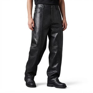 May include: Black trousers featuring a textured crocodile-embossed pattern throughout. These trousers include a standard waistband with a button closure, a front zip fly, and vertical seam detailing running down the front of each leg.