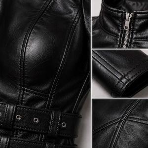 May include: A black leather jacket featuring a front zipper closure, a high collar, and a waist belt with metal eyelets. The garment displays detailed vertical seam stitching, a smooth texture, and silver-toned hardware throughout the design.