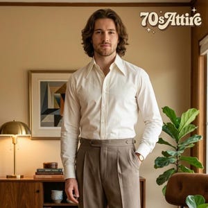 May include: A long-sleeved cream-colored button-down shirt with a wide pointed collar and taupe trousers featuring a high-waisted design with side adjusters. The text 70sAttire is visible in the upper right corner of the image.