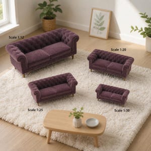 May include: Four miniature purple tufted sofas in varying sizes labeled Scale 1:12, Scale 1:20, Scale 1:25, and Scale 1:30. Each sofa features a rolled arm design, button-tufted back and sides, and small wooden legs, arranged on a white rug.