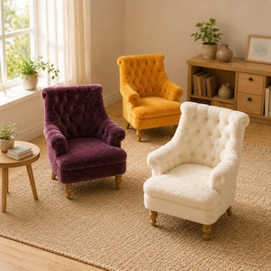 May include: Three small armchairs with tufted backs and rolled arms, upholstered in textured fabric. One chair is deep purple, one is mustard yellow, and one is cream. Each chair features four short, light-colored wooden legs.