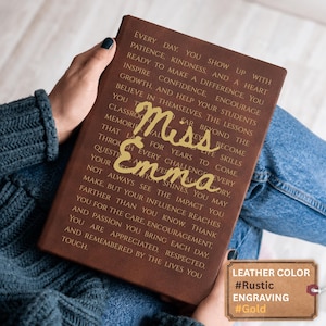 May include: A brown leather journal featuring gold engraved text that reads: Every day, you show up with patience, kindness, and a heart ready to make a difference. You inspire confidence, encourage growth, and help your students believe in themselves. Miss Emma.
