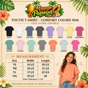 May include: A color chart for Comfort Colors 9018 youth t-shirts featuring 15 solid color options including black, white, blue jean, pepper, violet, orchid, butter, crunchberry, seafoam, blossom, chalky, gray, melon, chambray, and neon pink.