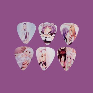 May include: Six guitar picks featuring anime characters with pink, white, and blue accents. The picks are shaped like a teardrop.