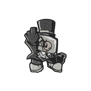 May include: An embroidered patch featuring a cartoon character wearing a black top hat and suit, with a light-colored square head and a small face. The character is gesturing with a raised middle finger, rendered in shades of black, white, and gray.