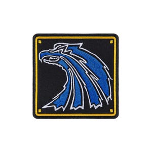 May include: A square embroidered patch featuring a stylized blue eagle head profile on a black background. The design is outlined in white and framed by a thin yellow border with small yellow squares at each of the four corners of the patch.