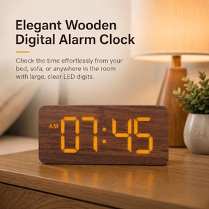 May include: A rectangular digital alarm clock with a dark brown wood grain finish. The front display features bright orange LED digits showing the time 07:45 and the letters AM. The text Elegant Wooden Digital Alarm Clock is visible above.