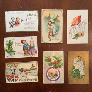 7 Vintage Christmas cards Postcards Victorian Children, Christmas bells, holly, snowman 1910-20