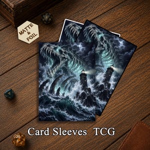 May include: Two rectangular card sleeves featuring a dark, stormy ocean scene with a towering lighthouse and a large, skeletal sea creature emerging from the waves. The artwork uses shades of blue, black, and white with glowing teal accents.