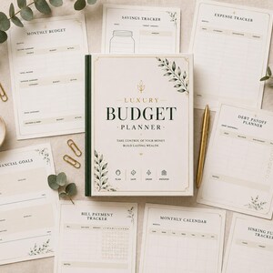 May include: A cream-colored Luxury Budget Planner book with black text and botanical illustrations, surrounded by matching financial tracking sheets including a monthly budget, expense tracker, debt payoff planner, and savings tracker with gold paper clips.