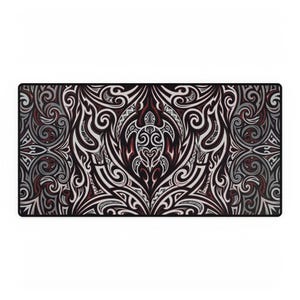 May include: A rectangular desk mat featuring a symmetrical, intricate tribal pattern in shades of black, white, and dark red. The central design highlights a stylised sea turtle motif surrounded by elaborate, flowing scrollwork and geometric lines.