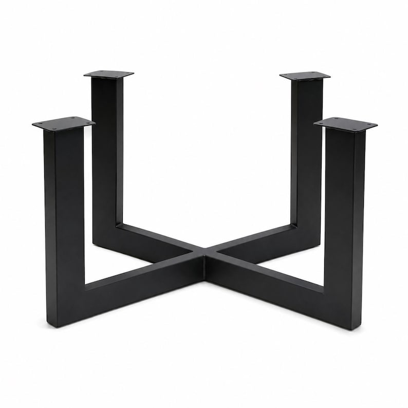 May include: A black metal table base featuring a cross-shaped frame with four vertical legs. Each leg is topped with a flat square mounting plate containing four pre-drilled holes for attachment, constructed from solid matte black steel tubing.