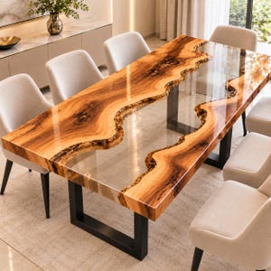 May include: A rectangular dining table featuring two natural live-edge wood slabs with a glossy finish, separated by a clear glass centre panel. The table is supported by two black metal U-shaped legs and is surrounded by six light-coloured chairs.