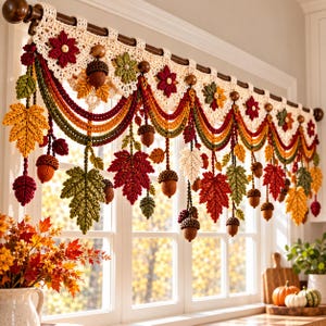 May include: A crochet window valance featuring a cream-colored base with hanging autumn-themed decorations including red, green, and yellow maple leaves, brown acorns, and small flowers, all suspended from a dark wooden curtain rod over a window.
