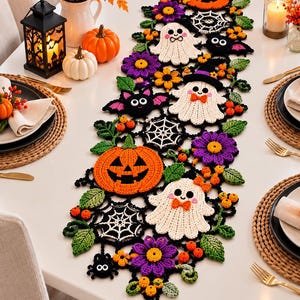 May include: A long, rectangular crochet table runner featuring a repeating pattern of orange pumpkins, white ghosts with orange bow ties, purple flowers, black bats with white eyes, white spider webs, green leaves, and small black spiders.