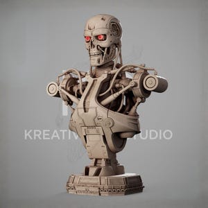 May include: A beige-colored bust of a robotic skeleton featuring a skull with glowing red eyes, exposed mechanical wiring, and intricate hydraulic components on the chest and shoulders, mounted on a base with the word TERMINATOR embossed on it.
