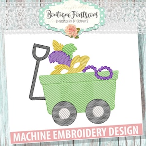 May include: Machine embroidery design of a green wagon filled with purple and gold Mardi Gras beads, masks, and feathers.