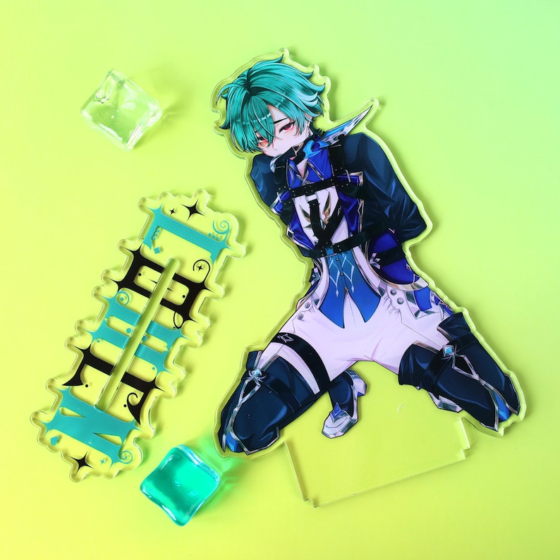 May include: An acrylic standee featuring an anime-style character with teal hair, wearing a blue and white outfit with black straps, kneeling on a clear base. Beside it is a rectangular acrylic piece with the text "BAIZHU" in black and teal.
