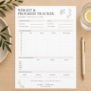 May include: A white paper weight and progress tracker sheet with black text. It includes sections for starting point, goal, 12-week progress, body measurements, and beyond the scale metrics. The design features small leaf illustrations and the text Rise + Thrive Collective.
