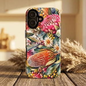 May include: A smartphone case featuring a vibrant watercolour print of Australian native flora, including a large pink protea, a textured orange banksia, small yellow wattle blossoms, and various green eucalyptus leaves against a white background.