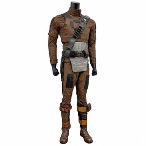 May include: A brown long-sleeved jumpsuit costume featuring a high collar, black rectangular patches on the thighs, and a grey chest plate. A black utility belt and shoulder strap with dark metallic accents are worn over the torso and waist.