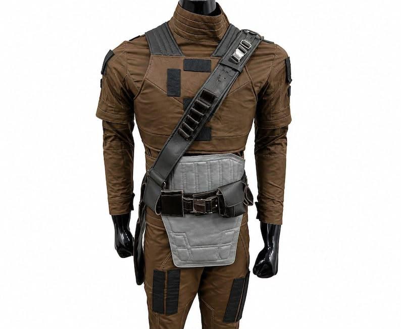 May include: A brown long-sleeved tactical suit featuring a high collar, black rectangular patches on the shoulders and legs, a black diagonal shoulder strap with loops, and a gray padded abdominal guard secured by a black utility belt with pouches.