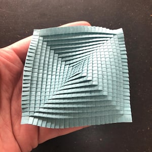 Pleat | Folded paper object made of handmade paper | Small paper sculpture with a movable structure