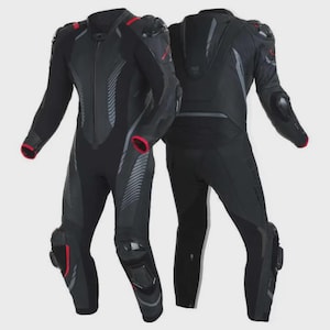 May include: A black motorcycle racing suit featuring red accents, protective armour plating on the shoulders, elbows, and knees, and a central front zip. The suit displays a textured pattern on the chest and back with integrated ventilation panels.