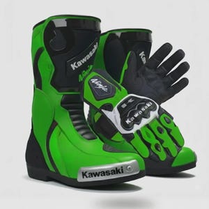 May include: A pair of bright green and black motorcycle boots and matching gloves. The boots feature the Kawasaki logo and Ninja branding. The gloves have black palms, green and black fingers, and a white Kawasaki logo on the wrist strap.