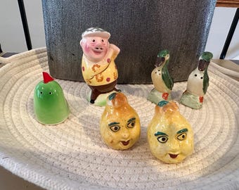 Mid century set of 3 salt and pepper shakers.  Made in Japan. Golfer and accessory. Pair of pears. Mallard duck couple. In great shape.