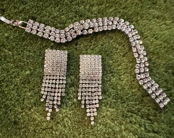 Mid century glamour rhinestone Demi-parure. Triple row tennis bracelet and waterfall fringe earrings.