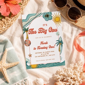 May include: A rectangular birthday invitation card featuring a beach theme with palm trees, surfboards, waves, and sun illustrations. The text reads: It's The Big One, Join us to celebrate, Noah is turning one, Saturday, 24 August 2026 at 6:30 PM, 123 Anywhere St., Any City, rsvp to Emma: 123-456-7890.