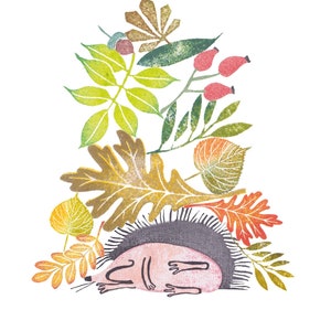 May include: Illustration of a sleeping hedgehog nestled among colorful autumn leaves and berries. The word "Servus" is printed in purple above the illustration. The artwork features a white background.