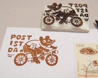 mail stamp bear on bicycle
