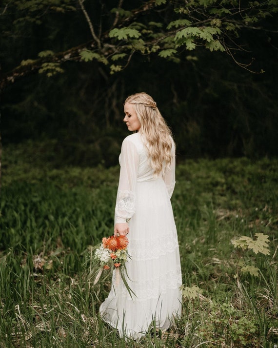 Bestseller Ivory Wrap lace wedding dress with chiffon mesh sleeves #1352 Bestseller Ivory Wrap lace wedding dress with chiffon mesh sleeves #1352
