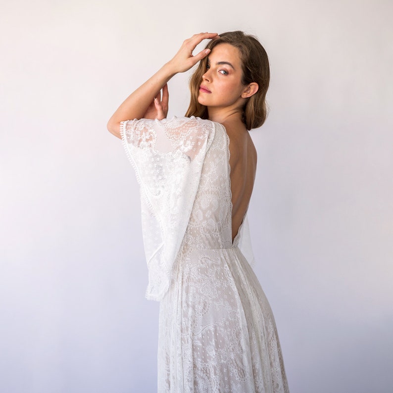 Bestseller Vintage Style Open Back, Deep V Neckline Angel Sleeves Bohemian Pearly White Wedding Dress 1468 image 1