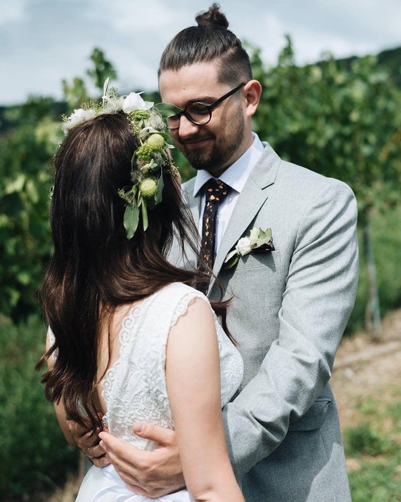 ivory wedding dress and gray suit Groom's Wedding Attire Guide: How to Match the Bride Wedding Shoppe