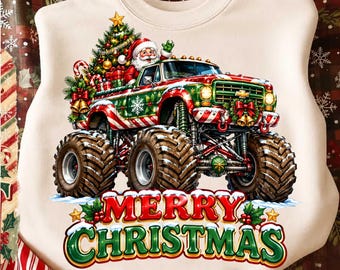 May include: A cream-colored sweatshirt featuring a graphic of a red and green monster truck driven by Santa Claus, carrying a decorated Christmas tree and gifts. Below the truck, the text reads Merry Christmas in red and green lettering.
