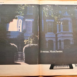 May include: A vintage magazine advertisement featuring a dark, moody photograph of a brick townhouse exterior with a white gate. The text reads A venue, Manchester. A Technics PCM Sound Series keyboard is pictured at the bottom right corner.