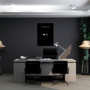 May include: A black rectangular wall art print featuring the white text MY EMOTIONAL RANGE above a white toggle switch graphic with the labels OFF and ON. The print is displayed on a dark gray wall above a gray desk with two black office chairs.