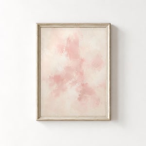 May include: A vertical rectangular wall art piece featuring an abstract painting with soft, blended brushstrokes in shades of pale pink and creamy off-white. The artwork is enclosed in a simple, light-toned wooden frame with a smooth finish.