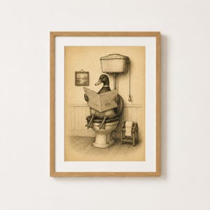 May include: A framed sepia-toned illustration of a duck sitting on a toilet reading a newspaper. The scene includes a wall-mounted toilet tank with a pull chain, a small framed picture on the wall, and a wooden toilet paper holder with a roll.