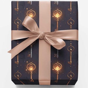 May include: A rectangular gift box wrapped in dark navy blue paper featuring a repeating pattern of glowing golden keys with intricate circular heads. The package is tied with a wide, smooth, light beige satin ribbon tied in a centered bow.