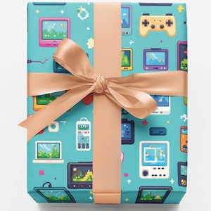 May include: A rectangular gift box wrapped in light blue paper featuring a repeating pattern of colorful pixelated video game consoles, handheld devices, and controllers, tied with a smooth, solid light tan satin ribbon and bow.