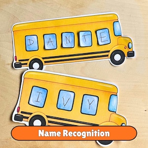 May include: Two yellow school bus cutouts with black trim and wheels. The top bus features blue windows with the letters D, A, N, T, E. The bottom bus features blue windows with the letters I, V, Y. An orange banner at the bottom reads Name Recognition.
