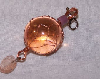 Opalescent Crystal in Hand Tied Copper Net, with Small Pink leaf and Lobster Claw Clasp