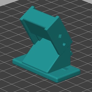 Peut inclure: Trois supports mécaniques de couleur sarcelle avec charnières réglables, chacun doté d'une base rectangulaire et d'une section supérieure pivotante. Les supports sont présentés avec différents degrés d'inclinaison pour montrer le mouvement.