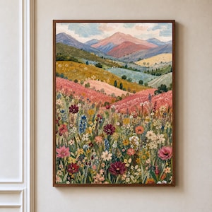May include: A framed landscape painting featuring a vibrant wildflower meadow in the foreground with various colorful blooms in shades of red, pink, yellow, and blue, leading to rolling hills and distant mountains under a soft, cloudy sky.